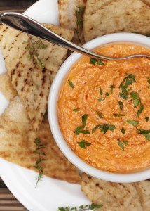 5 Minute Roasted Red Pepper and Feta Dip - Creamy and tangy. This easy, flavorful dip is the perfect party appetizer, a great burger topper, and wonderful as a sauce for shrimp or chicken. | justalittlebitofbacon.com