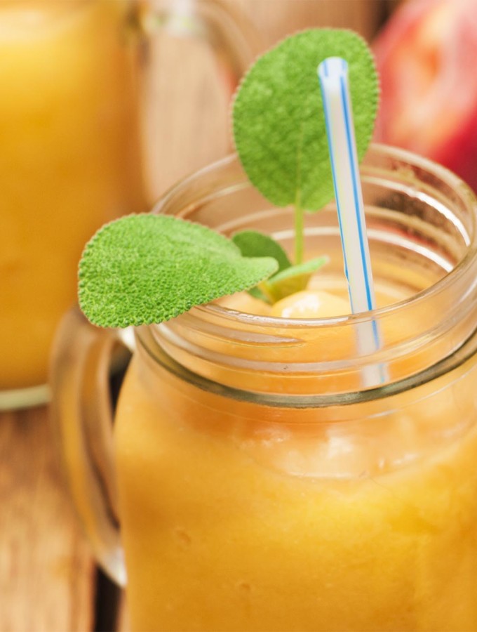 Peach Bourbon Frozen Cocktail with a hint of ginger - a sweet and spicy adult slushie that is the perfect end to a hot day | justalittlebitofbacon.com