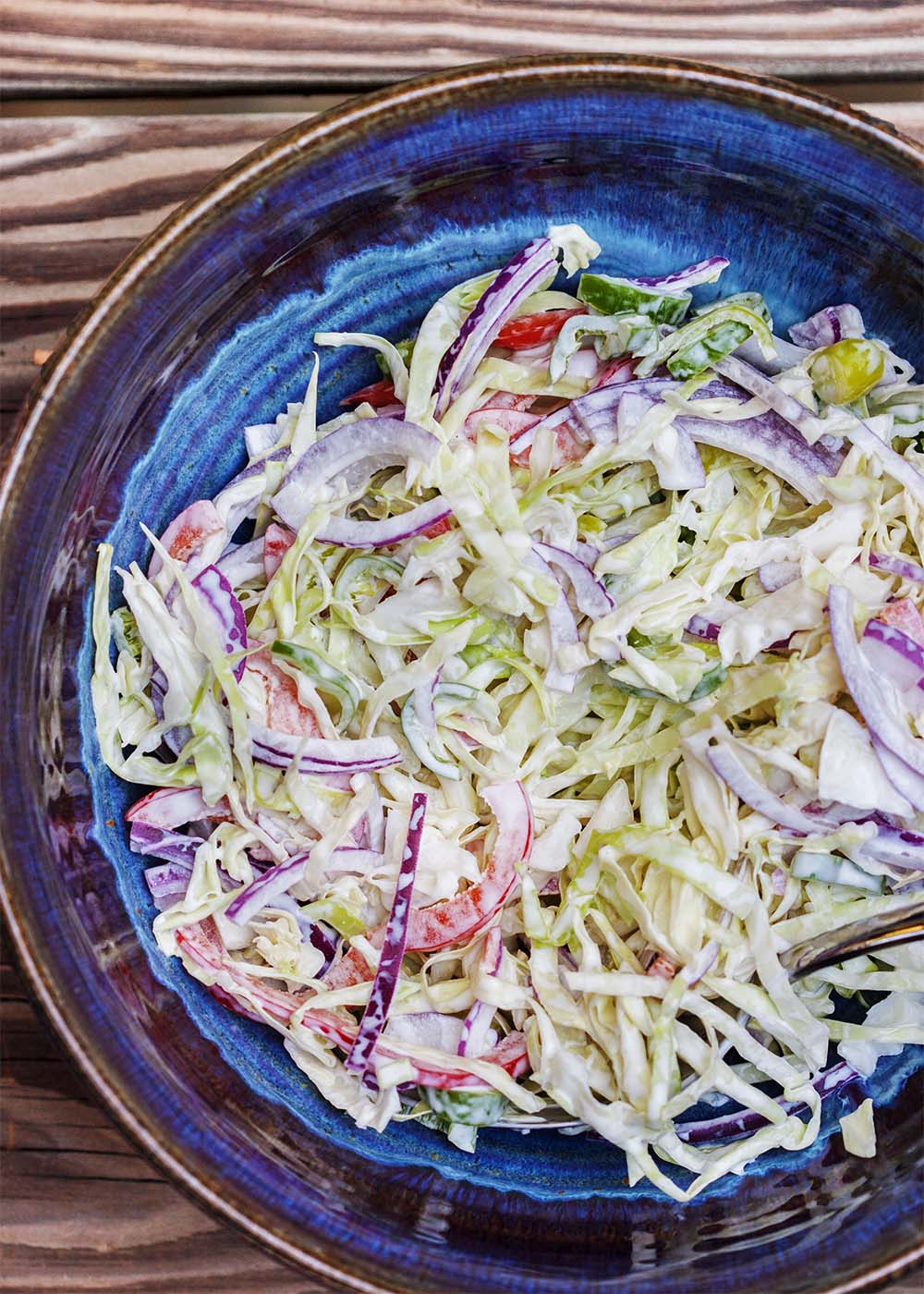 Spicy Jalapeno and Lime Coleslaw - This creamy, spicy coleslaw has a bit of a kick and is a great side dish to bring to a bbq or have on taco night. | justalittlebitofbacon.com