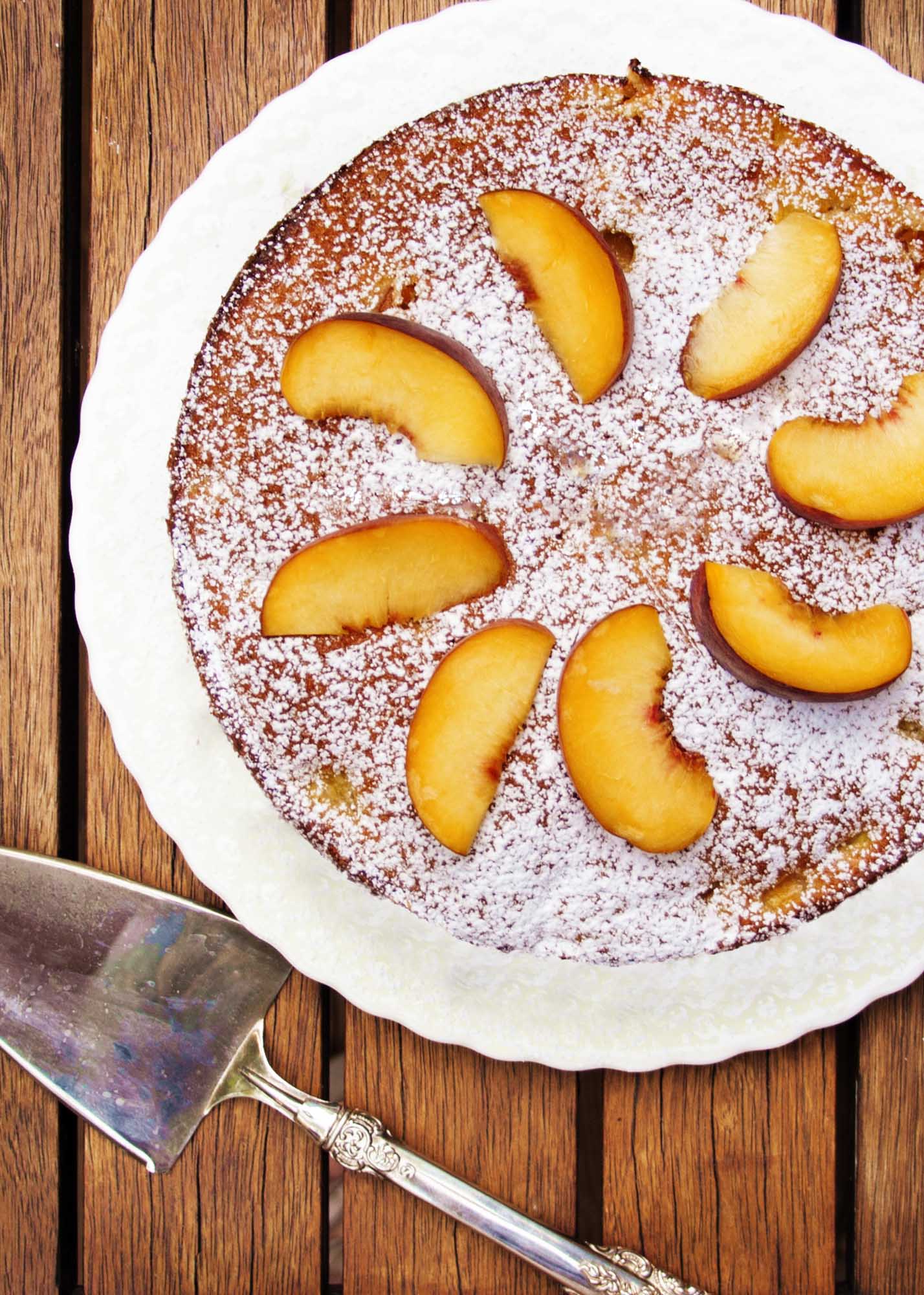 Summertime Peach Cake - Peaches, a hint of orange, and a cake which goes together in a snap and keeps for days | justalittlebitofbacon.com