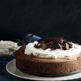 Dark Chocolate Mousse Pie - Dark chocolate whipped up into a creamy mousse layered over a crisp cookie crust and topped with mounds of whipped cream. Yum! | justalittlebitofbacon.com