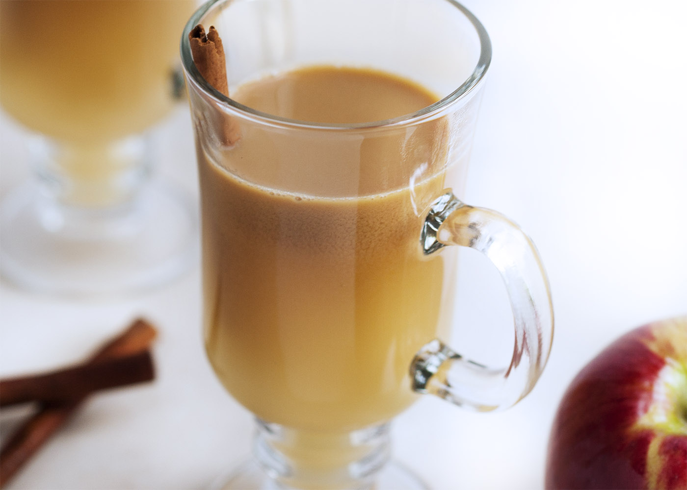 Hot Apple Pie Bourbon Cocktail - This twist on hot buttered bourbon uses cider and butterscotch sauce to make the perfect thanksgiving or fall cocktail. | justalittlebitofbacon.com