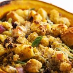 Hubbard Squash with Cornbread Stuffing - Looking for an impressive vegetarian centerpiece or side dish for your Thanksgiving table? Look no more! Filling a Hubbard squash with delicious cornbread stuffing is sure to produce oohs and ahhs. | justalittlebitofbacon.com