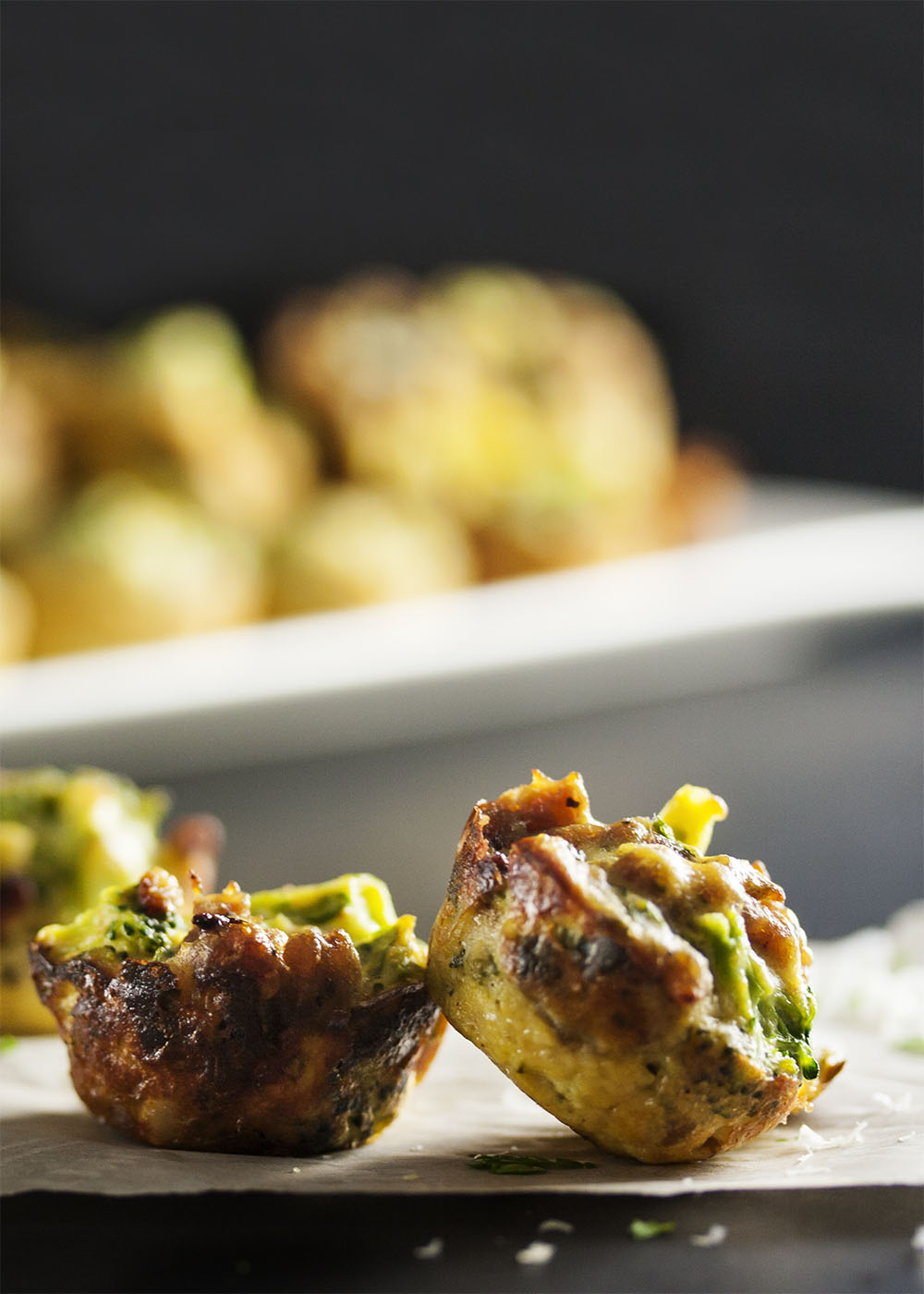 Three Cheese Broccoli Bites - Italian sausage and ricotta combine with broccoli and even more cheese to pack a pile of flavor into each little bite. Excellent as a side dish or an appetizer! | justalittlebitofbacon.com