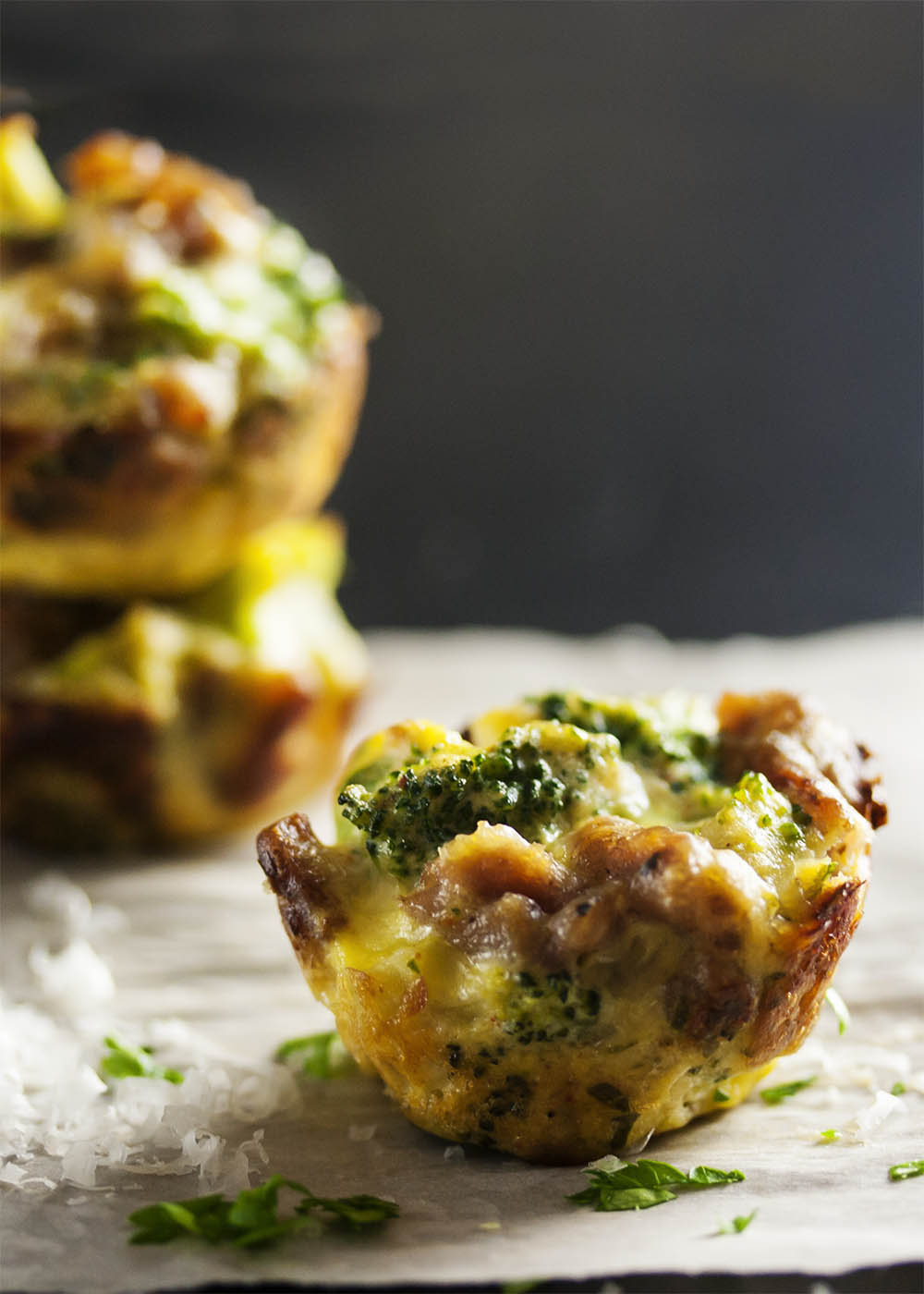 Three Cheese Broccoli Bites - Italian sausage and ricotta combine with broccoli and even more cheese to pack a pile of flavor into each little bite. Excellent as a side dish or an appetizer! | justalittlebitofbacon.com