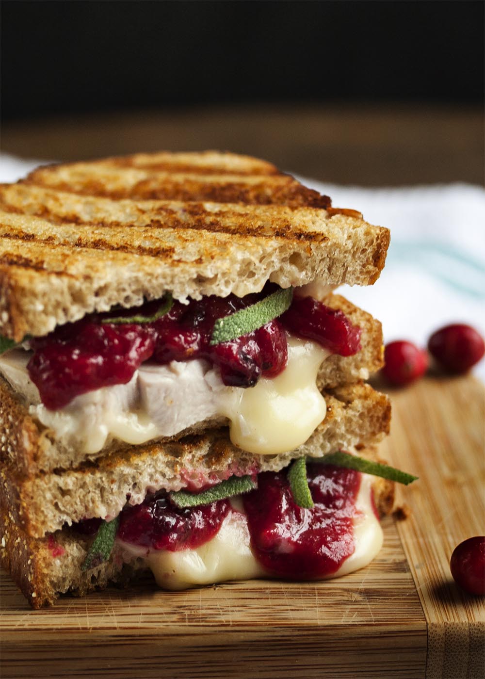 Turkey, Brie and Cranberry Mustard Panini - Once Thanksgiving is over, the question is what to do with all the leftovers. This turkey, brie, and cranberry panini provides the delicious answer. | justalittlebitofbacon.com