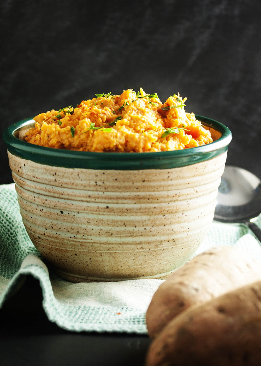 Chipotle Mashed Sweet Potatoes - Spicy, smoky chipotle in adobo sauce provides just the right amount smoky heat to balance out these creamy and buttery sweet potatoes. Excellent when paired with roasted or grilled meats! | justalittlebitofbacon.com