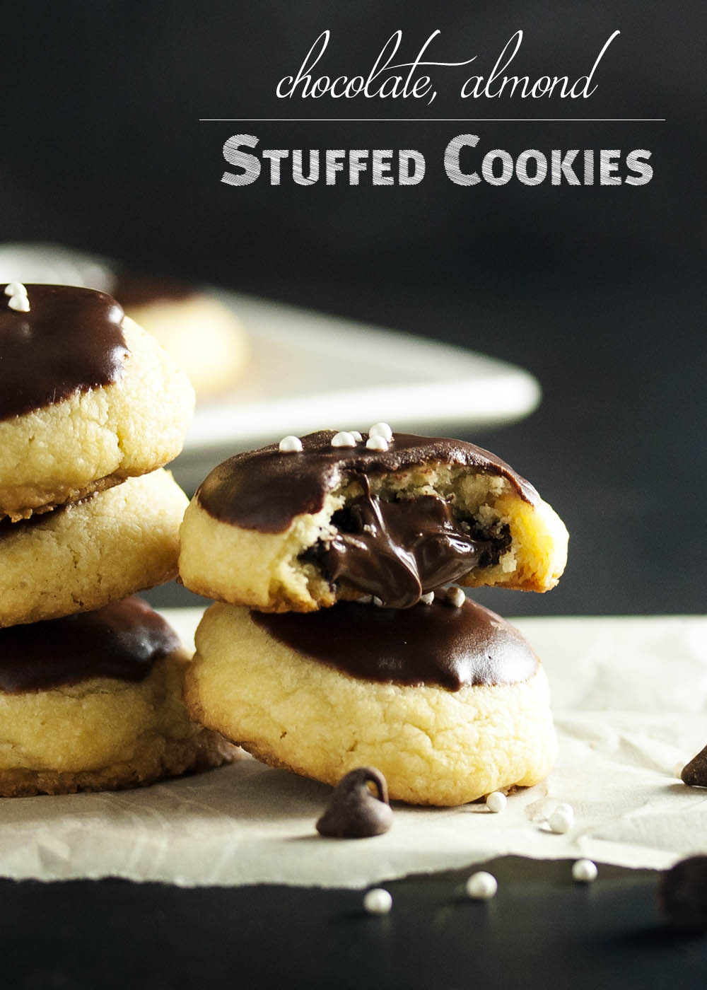 Chocolate Almond Stuffed Cookies - These chocolate covered cookies have a tender butter cookie outside and are filled with almonds and more chocolate! Just the thing to bring to a cookie exchange or to add to a cookie platter. | justalittlebitofbacon.com