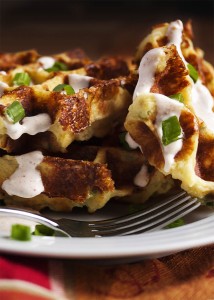 Loaded Mashed Potato Waffles - Mashed Potato Waffles are filled with scallions and cheese and are an awesomely tasty way to enjoy leftover mashed potatoes. Once you try them you may find yourself making mashed potatoes specifically to enjoy these waffles! | justalittlebitofbacon.com