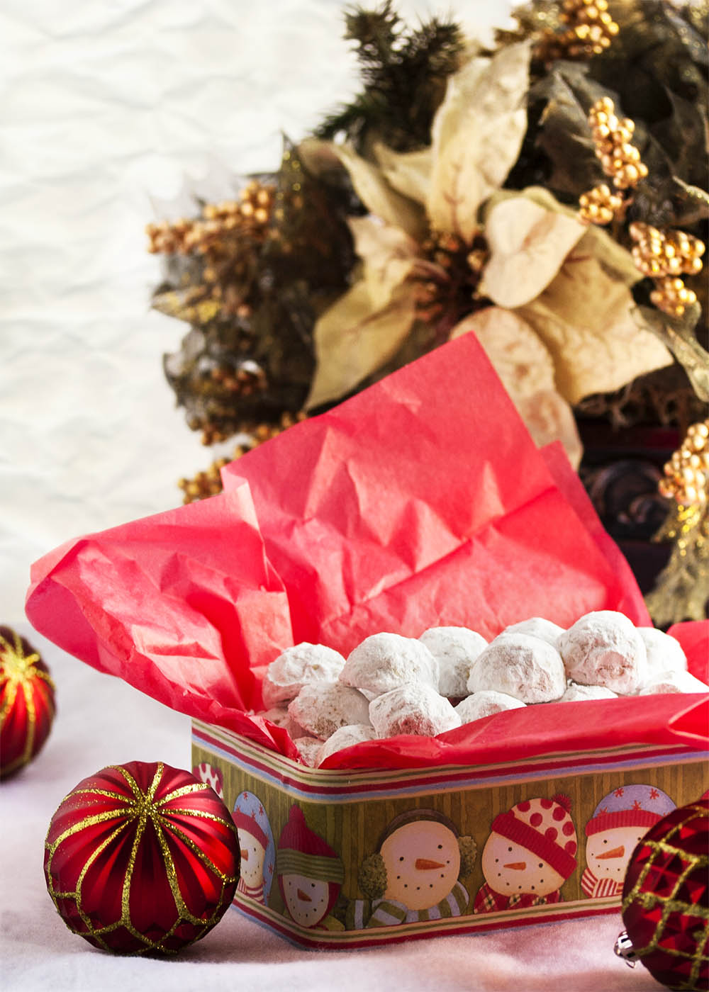 Pecan Snowball Cookies - These Pecan Snowball Cookies are melt-in-your-mouth tender, filled with ground and chopped pecans, and covered in powdered sugar. Whether you call them Snowballs or Russian Tea Cakes or Italian Wedding Cookies, it's not Christmas without them. | justalittlebitofbacon.com