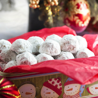 Pecan Snowball Cookies - These Pecan Snowball Cookies are melt-in-your-mouth tender, filled with ground and chopped pecans, and covered in powdered sugar. Whether you call them Snowballs or Russian Tea Cakes or Italian Wedding Cookies, it's not Christmas without them. | justalittlebitofbacon.com