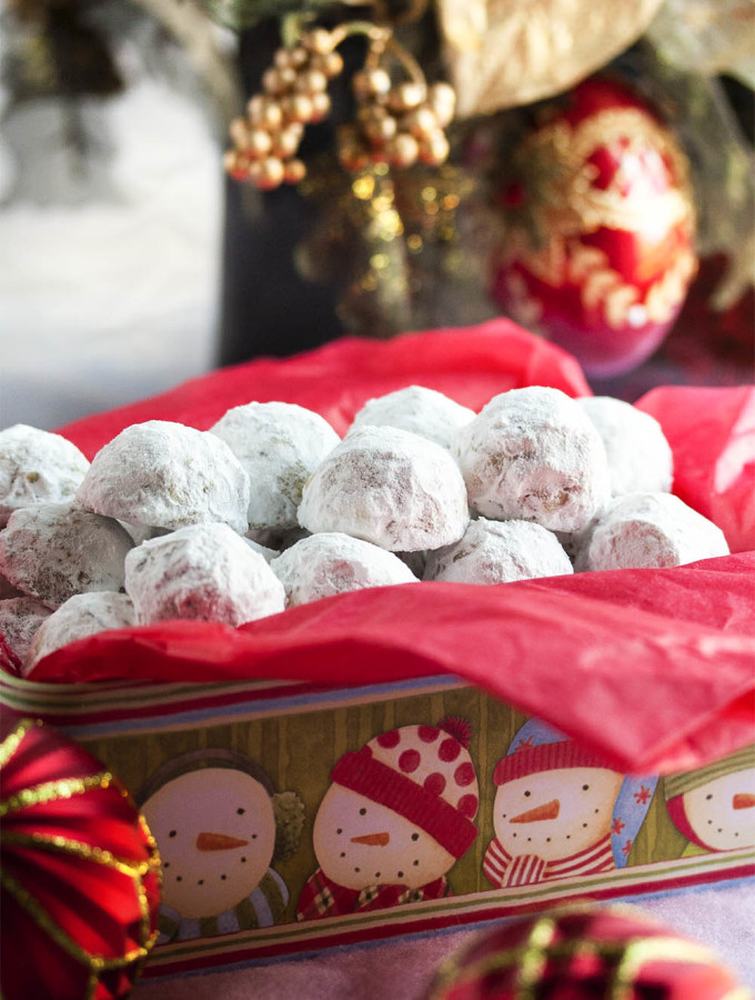 Pecan Snowball Cookies - These Pecan Snowball Cookies are melt-in-your-mouth tender, filled with ground and chopped pecans, and covered in powdered sugar. Whether you call them Snowballs or Russian Tea Cakes or Italian Wedding Cookies, it's not Christmas without them. | justalittlebitofbacon.com