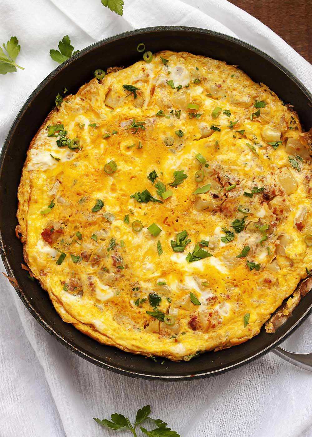 Potato and Chorizo Spanish Tortilla - My Spanish tortilla is full of organic eggs and local chorizo and potatoes. It's bursting with flavor and makes a great lunch or dinner with nice, green salad. | justalittlebitofbacon.com