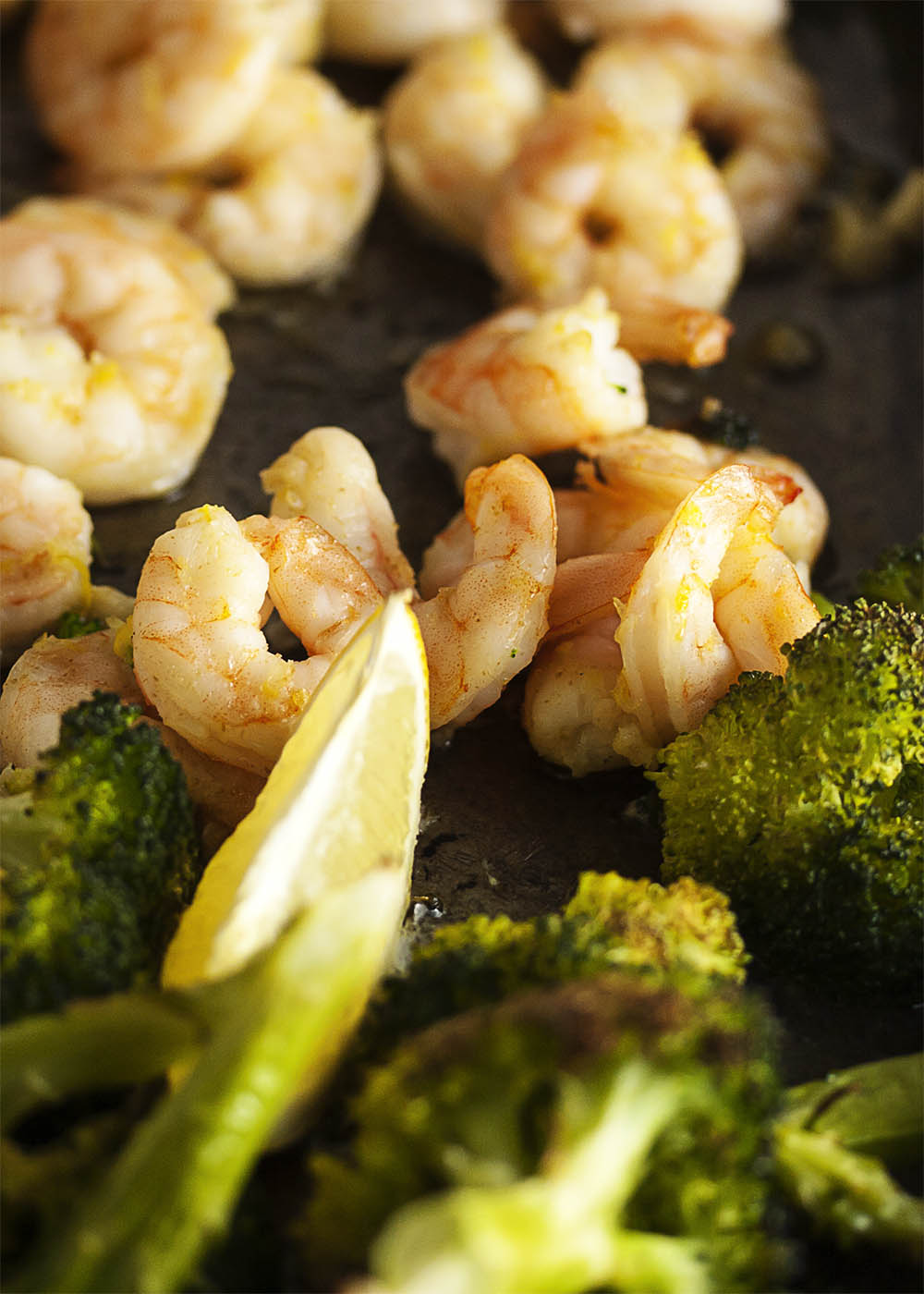 Oven Roasted Shrimp and Broccoli - This simple and satisfying dinner of shrimp, broccoli, and couscous goes from oven to table in only 20 minutes and two pans. | justalittlebitofbacon.com