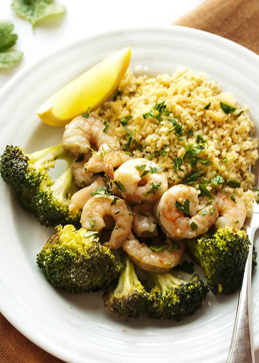 Oven Roasted Shrimp and Broccoli - This simple and satisfying dinner of shrimp, broccoli, and couscous goes from oven to table in only 20 minutes and two pans. | justalittlebitofbacon.com
