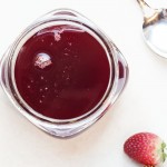 Strawberry Vanilla Bean Syrup - This strawberry vanilla syrup is full of intense strawberry flavor that you will love on pancakes, mixed into yogurt, poured on pound cake, made into cocktails, and so many other ways! And it all starts from frozen strawberries. | justalittlebitofbacon.com