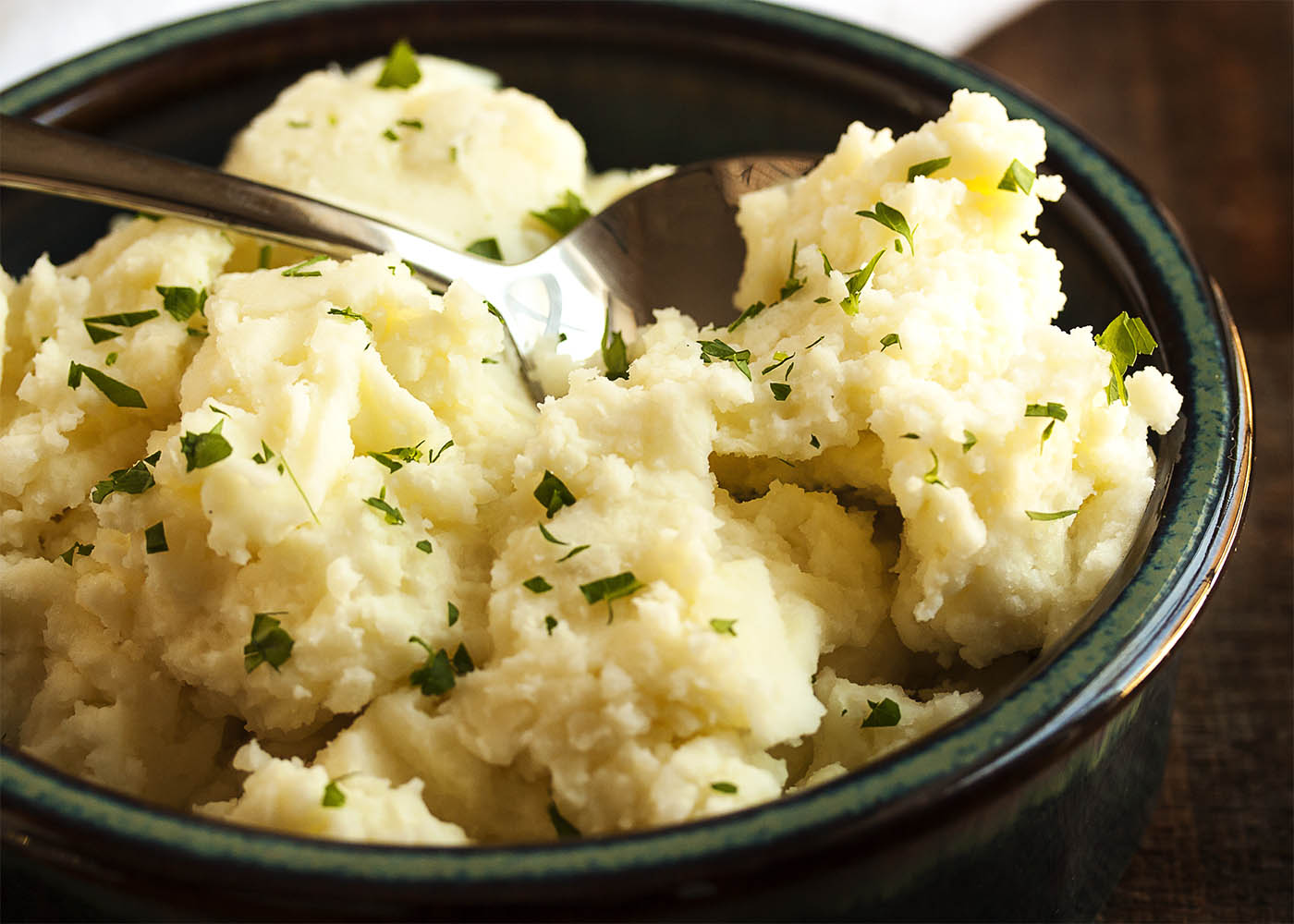 Cream Cheese Mashed Potatoes - Peeled yellow potatoes are simmered in salted water and then mashed with cream cheese and a splash of heavy cream in these amazingly tasty mashed potatoes. | justalittlebitofbacon.com