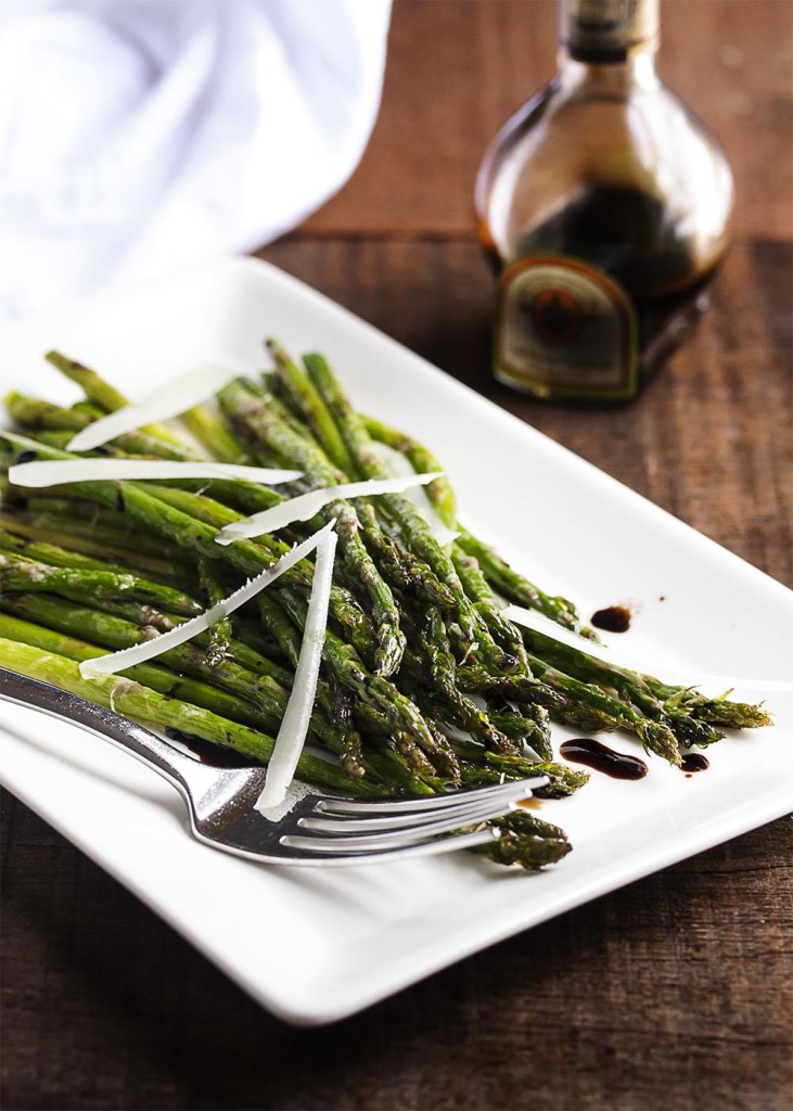 Roasted Asparagus with Parmesan and Balsamic - Asparagus is tossed with olive oil and parmesan before being roasted until crisp tender and then sprinkled with balsamic vinegar. An easy and flavorful side dish. | justalittlebitofbacon.com