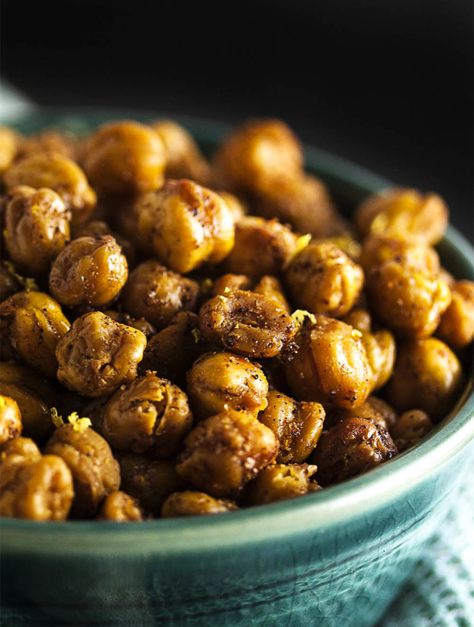 Spiced Dry Roasted Chickpeas - Dry roasting chickpeas produces an incredibly crunchy, tasty, and easy snack. And it's even healthy too! Just be careful - they're addictive. | justalittlebitofbacon.com