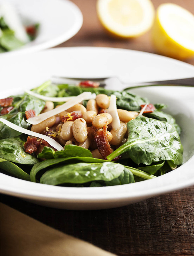 Warm White Bean, Bacon, and Spinach Salad - This is a hearty salad of baby spinach, warm white beans and a little bit of bacon which is perfect for chilly nights, all dressed in a sherry and shallot vinaigrette. | justalittlebitofbacon.com
