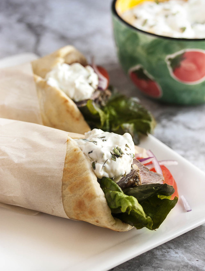Leftover Lamb Gyros with Tzatziki Sauce - What to do with leftover lamb roast? Make these incredibly yummy lamb gyros and top them with a 5 minute tzatziki sauce. | justalittlebitofbacon.com