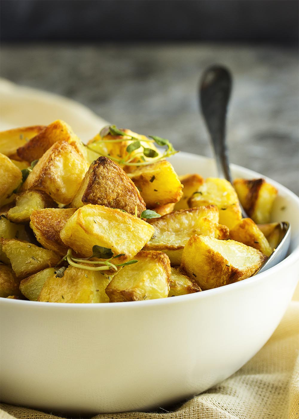Crispy Roasted Potatoes - There is just one little trick to turning basic roasted potatoes into extra crispy and yummy roasted potatoes. This is the roasted potato side dish you've been looking for. | justalittlebitofbacon.com