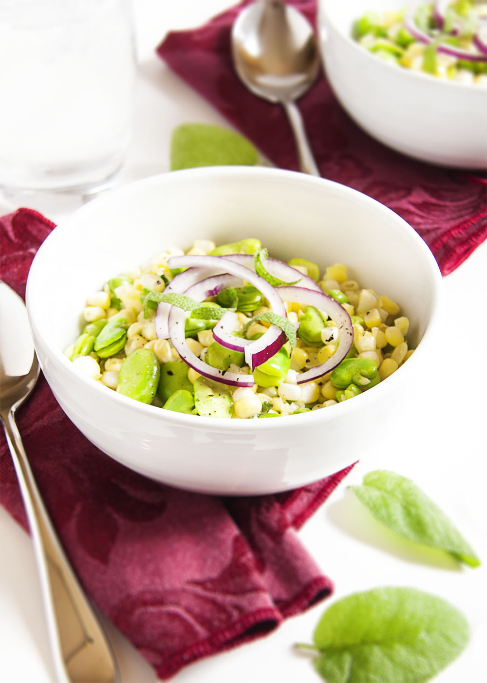 Fresh Corn and Fava Bean Salad - This fresh and flavorful salad of corn and fava beans is a great way to take that tiny pile of fava beans which you extracted from a giant pile of bean pods and turn it into a satisfying side dish. | justalittlebitofbacon.com