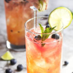 Fresh Blueberry Mojito - This blueberry mojito is full of fresh blueberry and mint flavor, and is an easy and refreshing summer drink perfect for sipping out of a straw. Great for cookouts or a warm evening on your deck! | justalittlebitofbacon.com