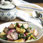 Roasted Turnips and Radishes - Sweet Hakurei turnips and young radishes are tossed with olive oil and roasted with their greens in this simple and satisfying side dish. | justalittlebitofbacon.com