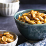 Spanish Spiced Almonds - Creamy, sweet marcona almonds are toasted and tossed in a flavorful paprika-spiked spice blend in this recipe for Spanish spiced almonds. | justalittlebitofbacon.com