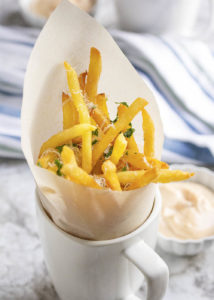 Parmesan Truffle Fries - Use frozen, bagged fries to have tasty truffle fries, covered in truffle oil, parmesan, and parsley on the table in less than 15 minutes. | justalittlebitofbacon.com