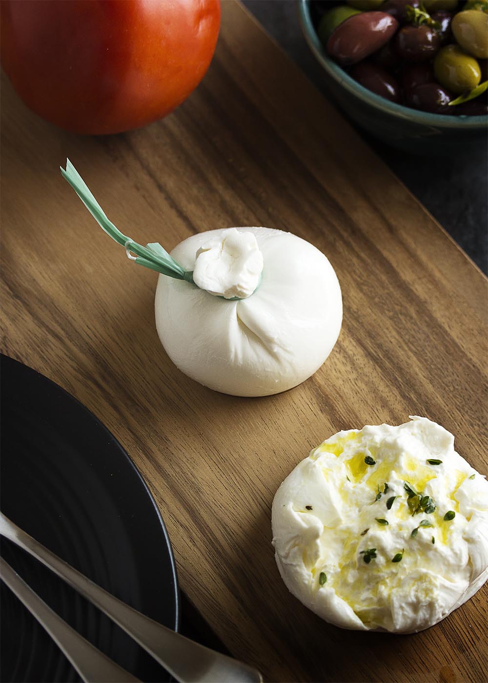 What is burrata? How do you cook burrata? These questions and more answered in this ingredient spotlight on burrata cheese. | justalittlebitofbacon.com