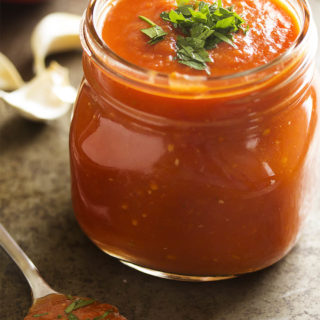 Authentic Italian marinara sauce is cooked low and slow to create a thick and flavorful sauce made in the manner of my family tradition. | justalittlebitofbacon.com