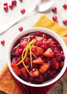 Check out this easy recipe for homemade cranberry sauce! Fresh cranberries are simmered in port wine and mixed with diced oranges to make a great Thanksgiving recipe for Cranberry Port Orange Sauce. | justalittlebitofbacon.com