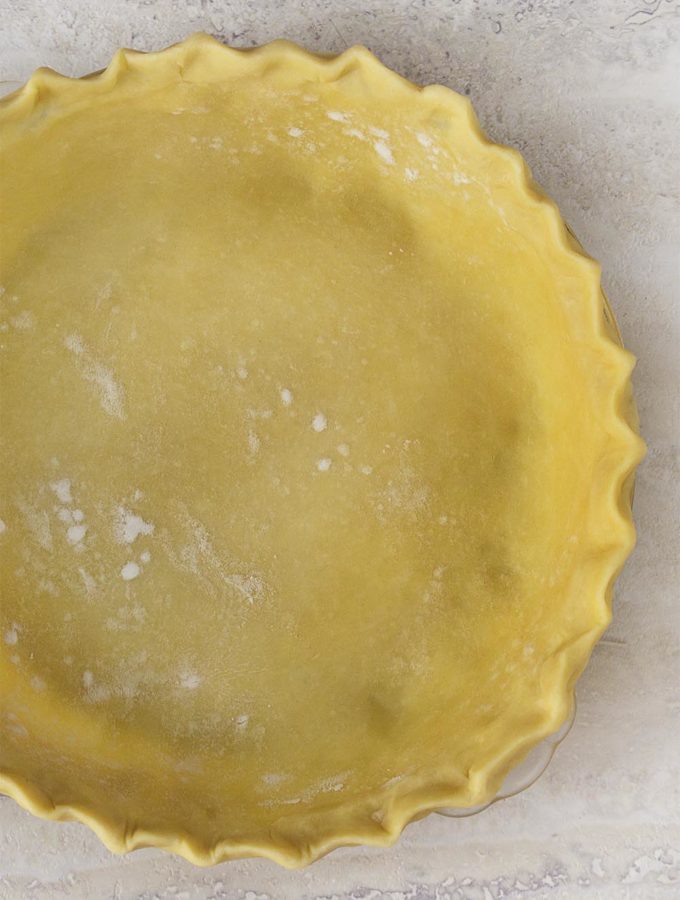 Throw out everything you know about making pie crust to make the best easy flaky pie crust you've ever made. Simple, all butter, no fail! | justalittlebitofbacon.com