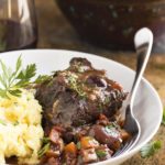 Beef short ribs are browned on the stove top and then oven braised for hours in red wine until they are meltingly tender in this recipe for french short ribs. | justalittlebitofbacon.com