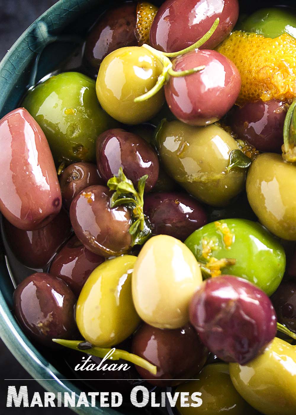 Italian marinated olives are an easy party appetizer of mixed olives, citrus, and herbs which takes only a few minutes to put together. | justalittlebitofbacon.com