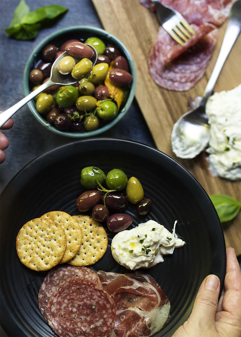Italian marinated olives are an easy party appetizer of mixed olives, citrus, and herbs which takes only a few minutes to put together. | justalittlebitofbacon.com