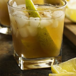 This pear bourbon cocktail smashes together overripe pears with maple syrup, allspice, and bourbon to make a great fall cocktail. | justalittlebitofbacon.com