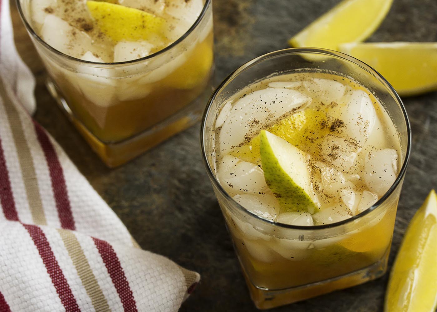 This pear bourbon cocktail smashes together overripe pears with maple syrup, allspice, and bourbon to make a great fall cocktail. | justalittlebitofbacon.com