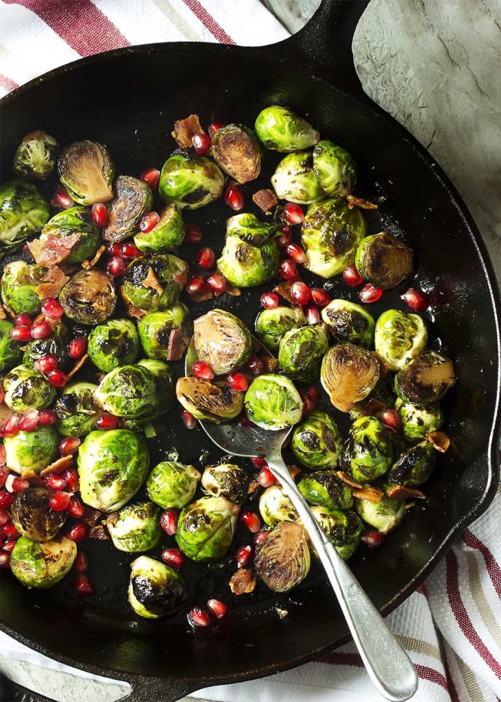 Pan Roasted Brussels Sprouts with Pomegranate Seeds Just a Little Bit of Bacon