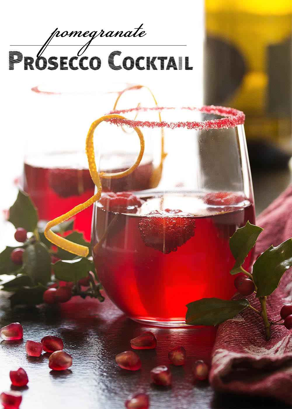 Easy, delicious, and full of bubbles! This pomegranate prosecco cocktail has everything you need for a great holiday drink. | justalittlebitofbacon.com