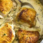 Creamy, on the table in 30 minutes, and with a nice bite from the mustard, one pot chicken thighs dijon is comfort food perfect for a weeknight meal. | justalittlebitofbacon.com