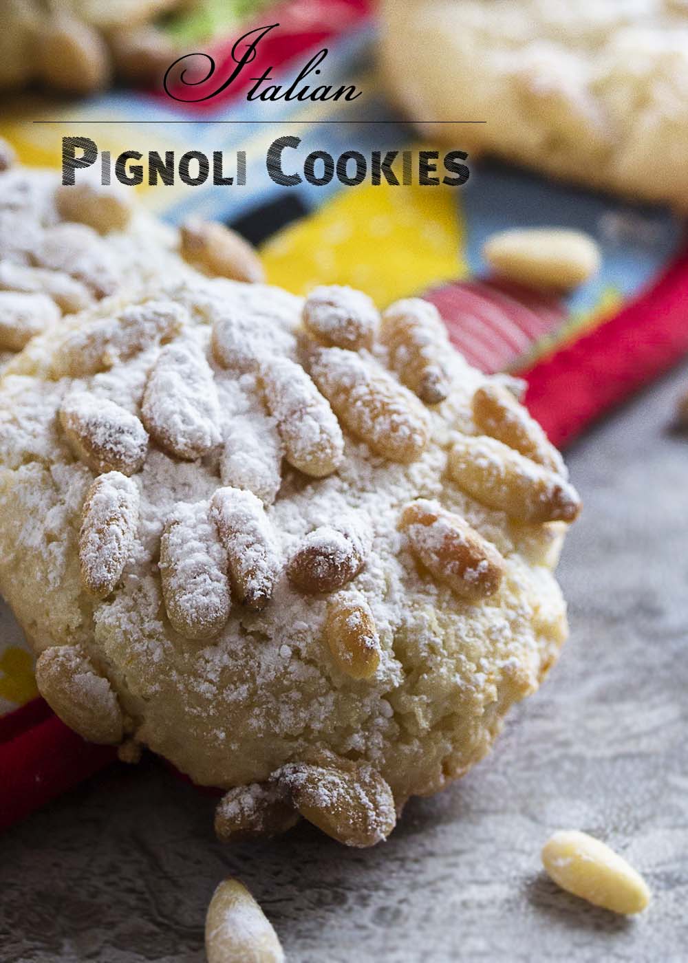 These gluten-free Italian pignoli cookies, adapted from Lidia Bastianich, are a great holiday cookie full of almonds and pine nuts! A great addition to a Christmas cookie tray. | justalittlebitofbacon.com