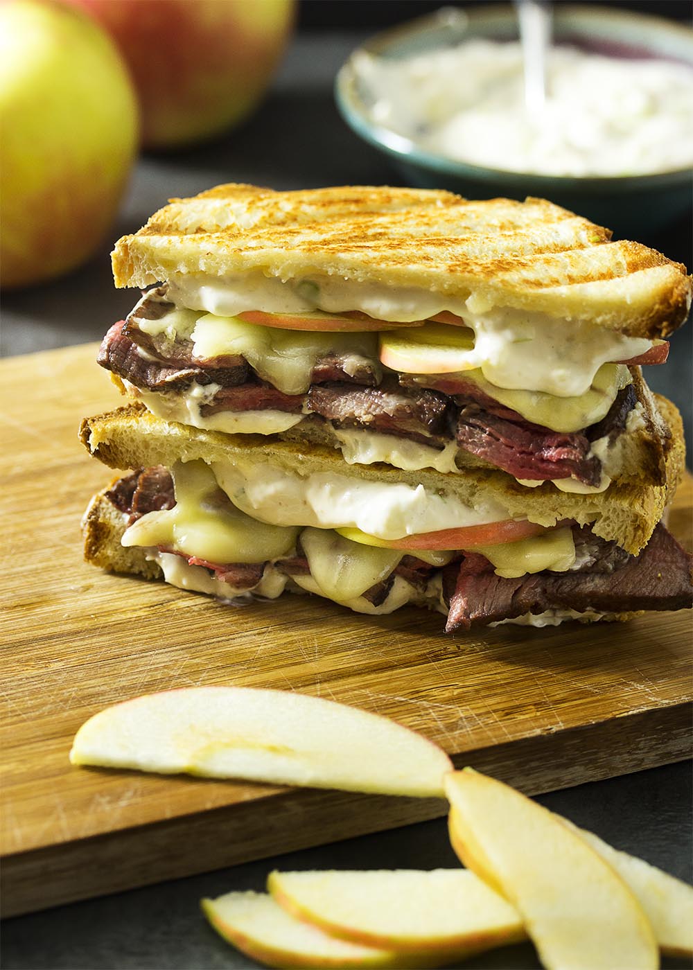 What to do with leftover roast beef? Layer it up on sourdough bread with apples, cheddar, and horseradish sauce for a roast beef panini! Great for lunch or dinner. | justalittlebitofbacon.com