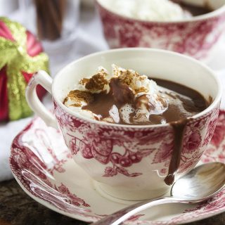 Cinnamon infused thick Italian hot chocolate is a not too sweet take on hot cocoa which is rich and decadent and intensely chocolaty. It's like drinkable bittersweet pudding! | justalittlebitofbacon.com