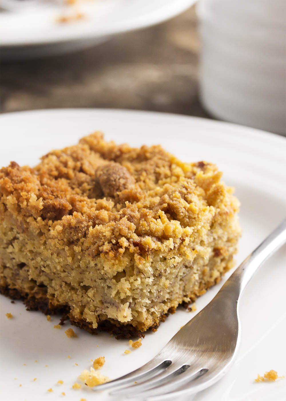 This easy moist banana cake with a buttery crumb topping is a great way to use up those overripe black bananas on your counter! | justalittlebitofbacon.com