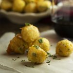 Light, fluffy, and crispy! These Spanish salt cod croquettes with aioli are bite-sized fish fritters perfect for a tapas party. | justalittlebitofbacon.com