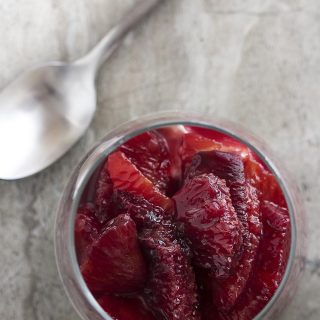Ruby red and cinnamon spiced, this blood orange compote is a beautiful and intensely flavored sauce perfect for spooning over creamy mascarpone mousse. | justalittlebitofbacon.com
