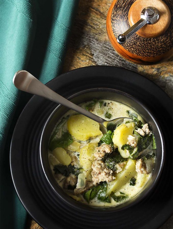 Love Olive Garden's zuppa toscana and want to make it at home? I've adapted the recipe to create a slow cooker zuppa toscana perfect to make on busy days! | justalittlebitofbacon.com